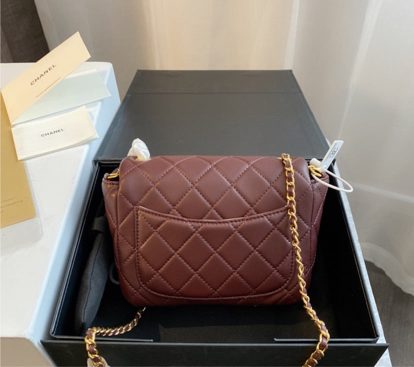 Burgundy Chanel women's handbag