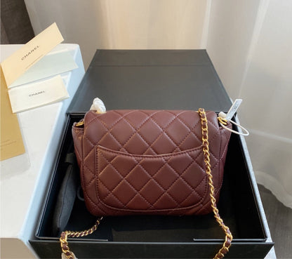 Burgundy Chanel women's handbag