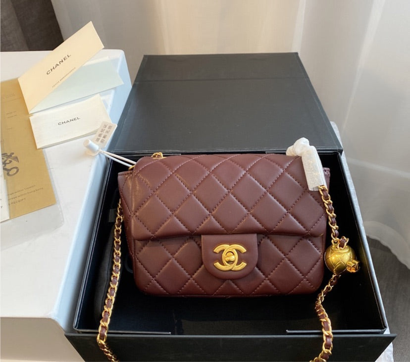 Burgundy Chanel women's handbag